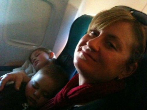 sleep on a plane, flying with toddler, traveling with kids, sunwing with baby