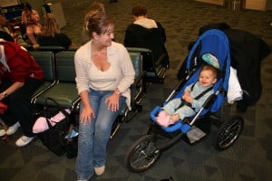 baby in stroller, airport gate, flying with an infant