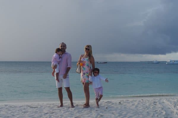 Enjoying cocktails on the beach while exploring Maldives with kids