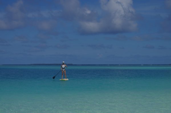 Stand Up Paddleboarding on a Maldives family holiday while exploring Maldives with kids