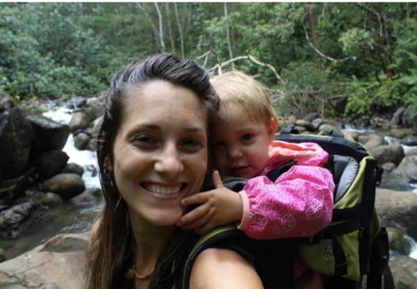 Toddler in backpack carrier hiking in Hawaii